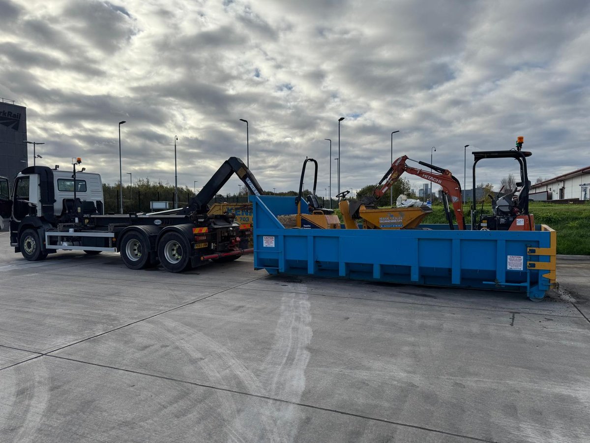 Professional excavation services in Manchester showing excavator at work on construction site